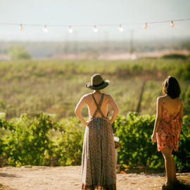 girl standing overlooking vineyard